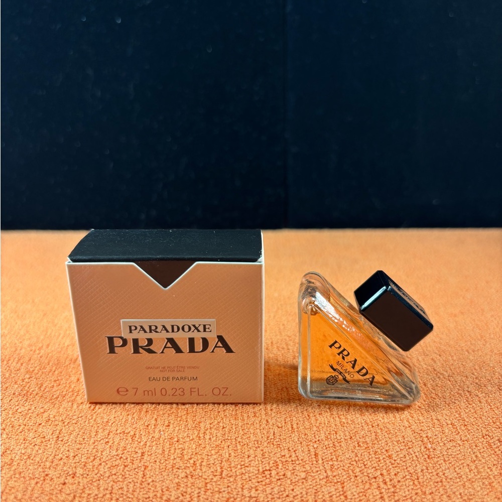 Prada Paradoxe Perfume with Black Cap and Orange Hue